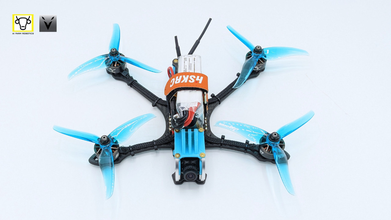 An open-frame quadcopter with blue propellers